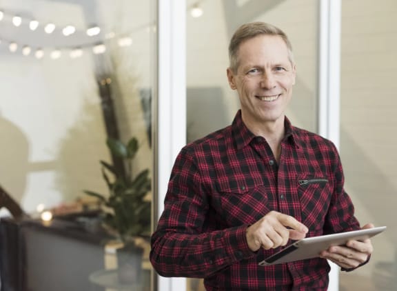 Adult patient holding a tablet