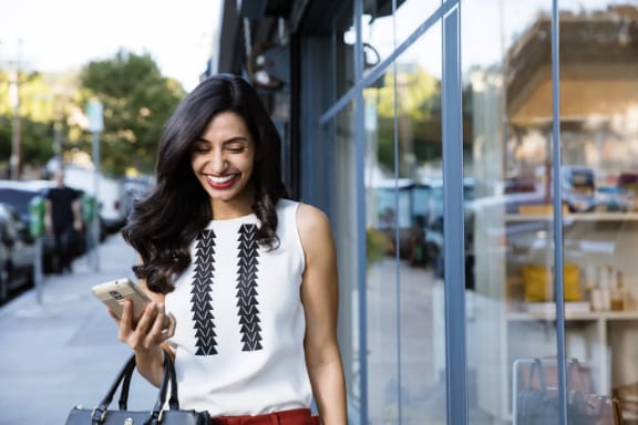 A patient smiling while wearing clear aligners
