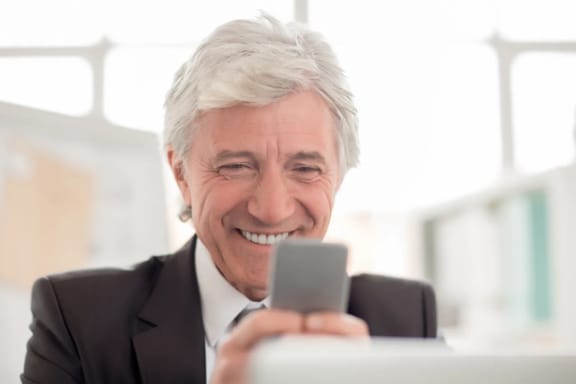 A mature man smiling