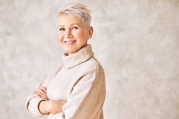A retired woman smiling
