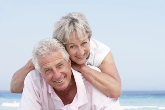 A senior couple smiling together