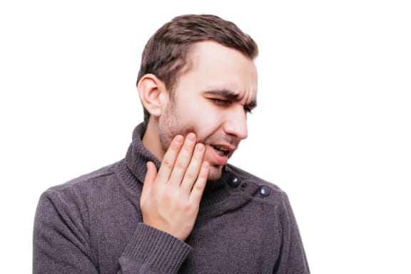 A patient experiencing a severe toothache