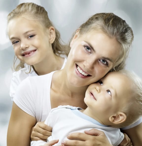 A young family smiling together