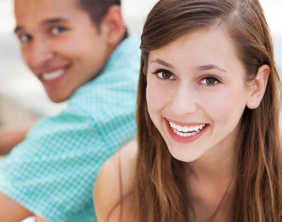 Patient smiling after wisdom tooth removal