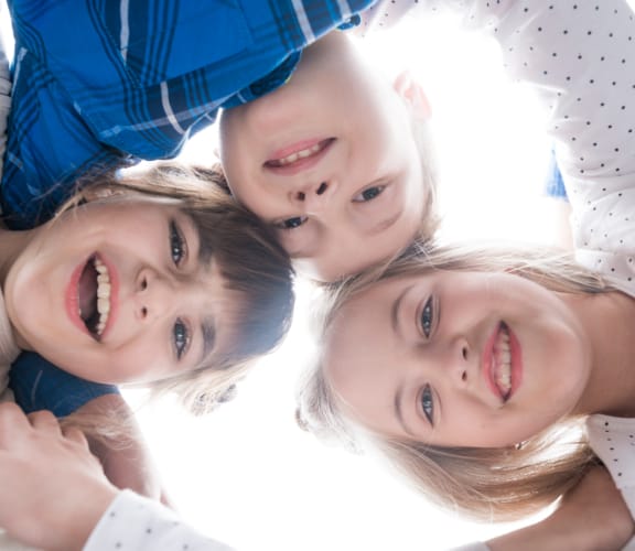 A group of children smiling together